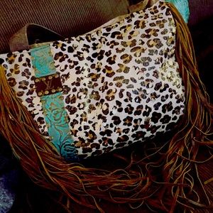 Custom turquoise tooled leather handmade bag with long leather fringe. LV patch